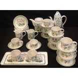 A Portmeirion Botanic Garden tea and coffee service comprising tea pot, coffee pot, cream jugs, side