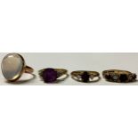 A 9ct gold moonstone ring, size J; a 9ct gold amethyst ring, size L; two other 9ct gold rings set