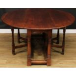 An oak double gateleg table, oval top with fall leaves, 73cm high, 164.5cm long, 52cm opening to