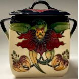 A Moorcroft Anna Lily pattern two handled biscuit barrel and cover, angular handles, 18cm, impressed
