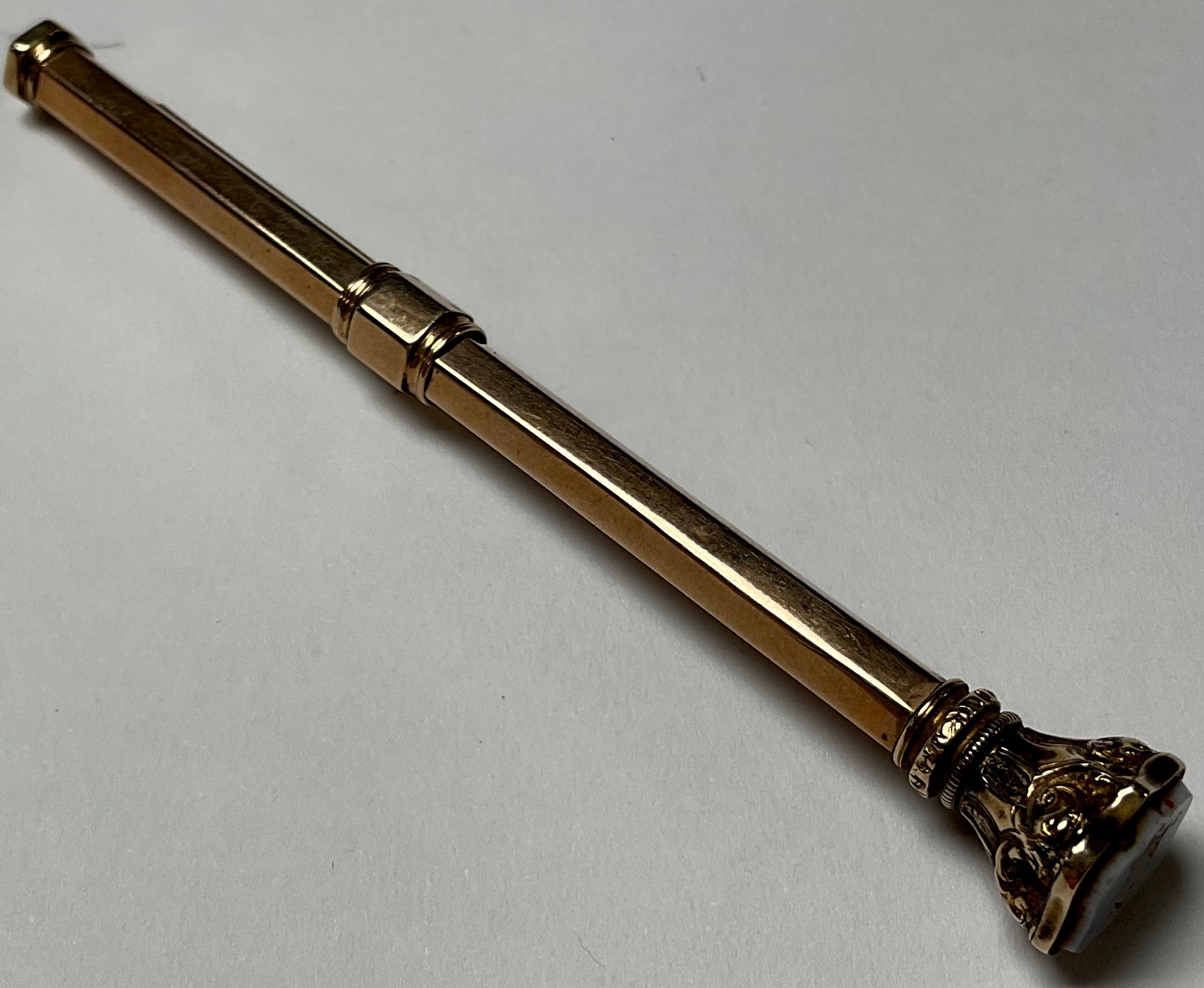 An early 20th century yellow metal propelling pencil, stone set finial, 9.4g gross - Image 4 of 4