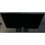 A Samsung 55" smart TV, model no. UA55D6600WN, TV only, lacking remote and cables