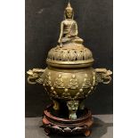 A Chinese gilt bronze incense burner and cover, crested by a seated Buddha, six character mark,