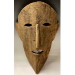 Tribal Art - a large 19th century ethnographic mask, of simple form, 51.5cm high