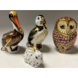A Royal Crown Derby paperweight, Barn Owl, silver stopper; others, Puffin, Brown Pelican and Rabbit,