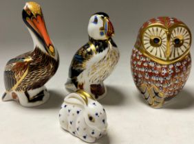 A Royal Crown Derby paperweight, Barn Owl, silver stopper; others, Puffin, Brown Pelican and Rabbit,