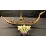 Asian Art - a Chinese carved horn dragon long boat, with figures, 66cm long; a carved soapstone vase