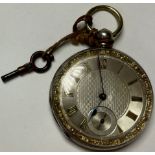 A Victorian silver open face pocket watch, with engine turned dial