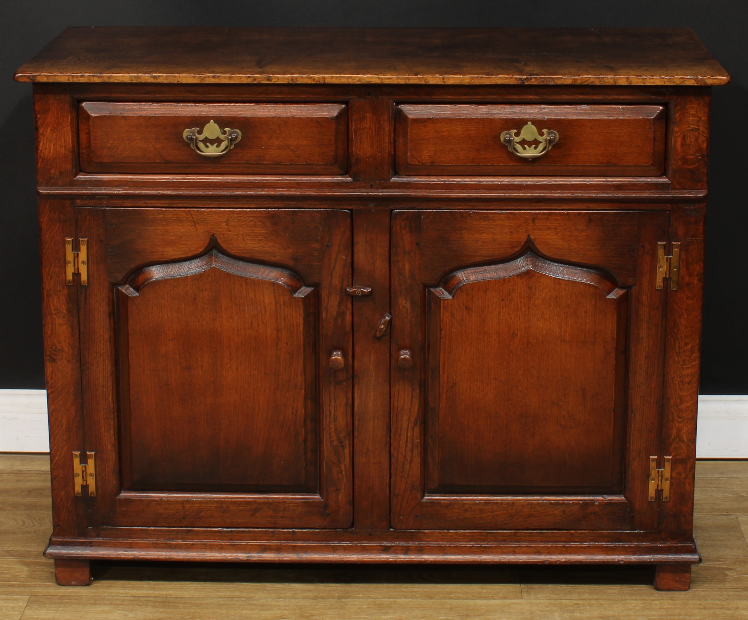 An oak side cabinet or low dresser, probably Titchmarsh & Goodwin, 84cm high, 107cm wide, 45.5cm