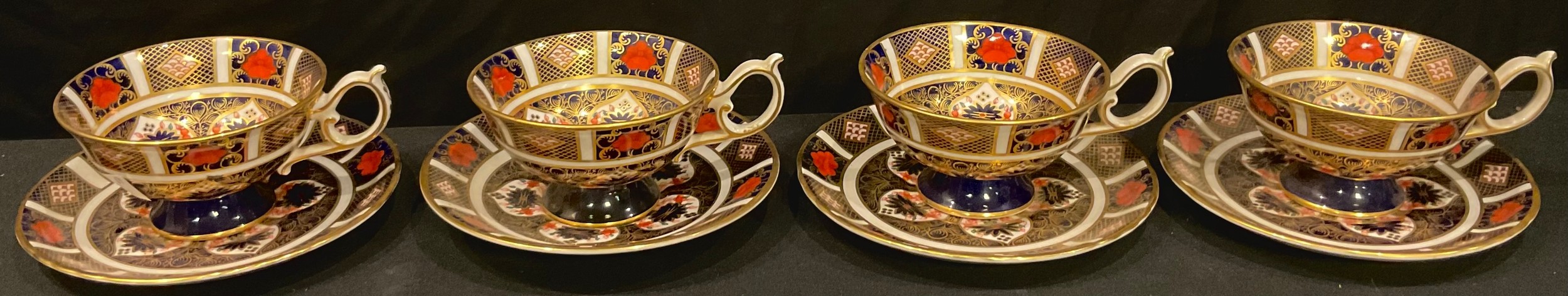 A set of four Royal Crown Derby Imari palette 1128 pattern teacups and saucers (saucers first