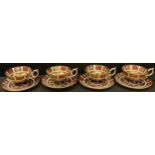 A set of four Royal Crown Derby Imari palette 1128 pattern teacups and saucers (saucers first