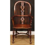 A 19th century yew and elm primary Windsor elbow chair, 108cm high, 57cm wide, the seat 41cm wide
