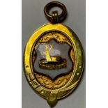 A 9ct gold fob medal, enamelled with Derby Buck in a Park, Birmingham 1925, 3.5g gross