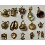 A quantity of 9ct gold charms, acorn, clam, slippers etc, 49.7g gross (16)