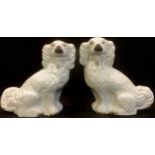 A pair of Victorian Staffordshire mantle dogs, 30cm high