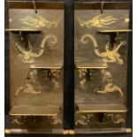 A pair of Oriental lacquered wall hanging shelves, decorated in gilt with dragons, 83cm x 31cm,