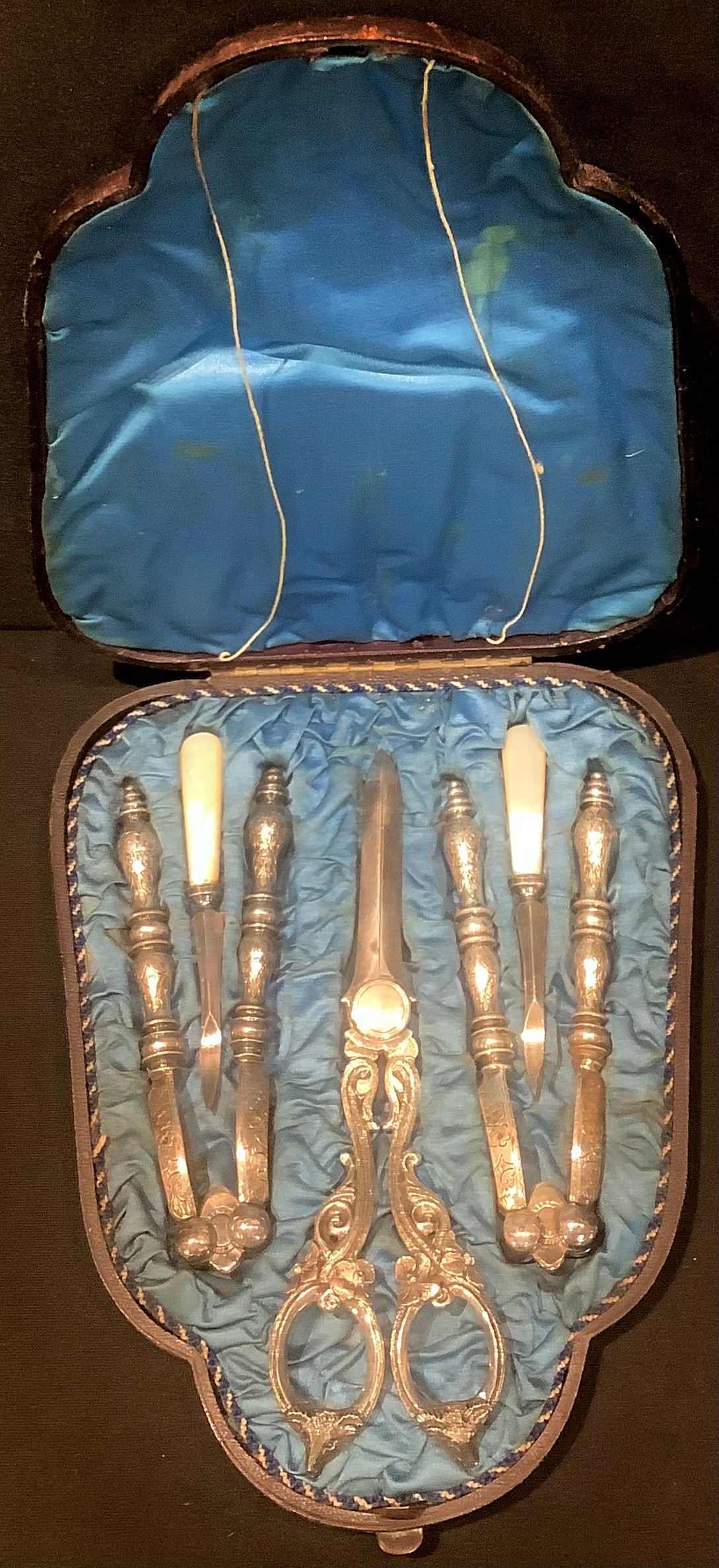 A Victorian grape scissors, nut cracker and nut pick set, Walker & Hall, Sheffield, cased