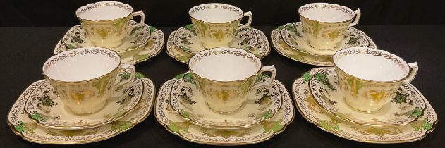 A set of six Royal Crown Derby 9917 pattern teacups, saucers and tea plates, printed marks, c.1935