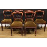 A set of six Victorian mahogany dining chairs, each with a shaped cresting rail, the mid-rail carved