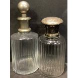 A large early 20th century French silver mounted scent bottle, c.1910; another scent or cologne