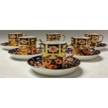 A set of six Royal Crown Derby 2541 pattern coffee cans and saucers, printed and painted marks in
