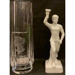 A facetted glass vase, engraved with bust and Olympic torch, 27.5cm high; a German white glazed