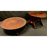 A mahogany Lazy Susan, tripod base, 48cm diam; a small oval drop leaf side table/stool, 26cm high,