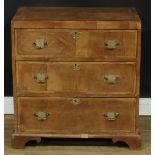 A George II Revival featherbanded walnut caddy top chest, of three long drawers, 75.5cm high, 75cm