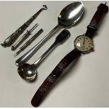 A silver cigar piercer; a silver tooth pick; a silver teaspoon; a silver condiment spoon; a silver