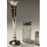 A Victorian hallmarked silver topped scent bottle, Birmingham 1886; a silver topped jar; a