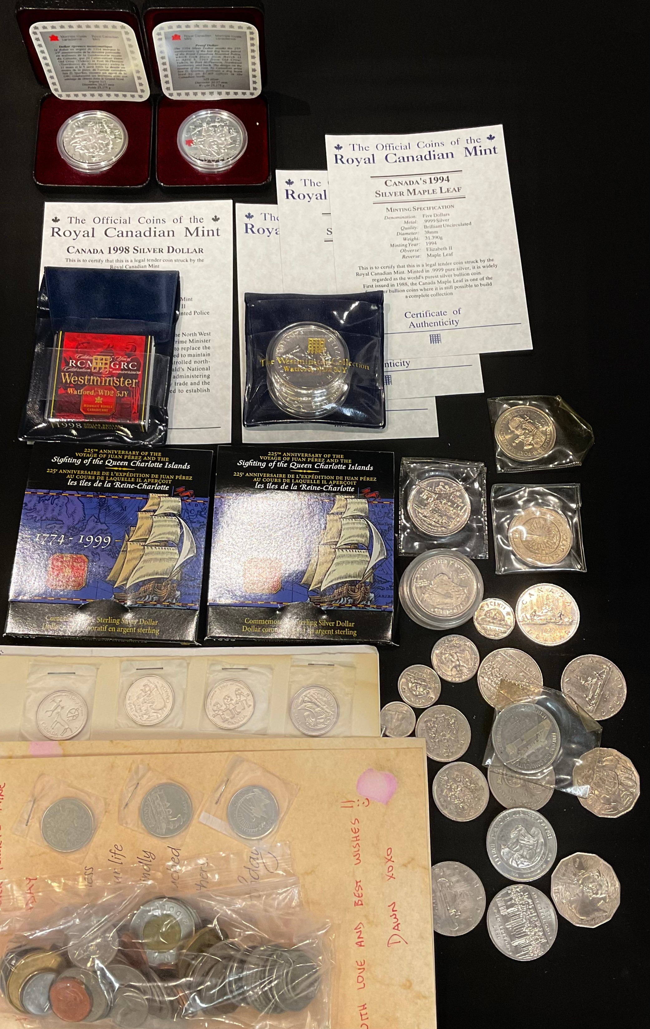 Canadian coins: two silver $1 Maple Leaf 1994 BU; Silver $1 Royal Canadian Mounted Police 1998, BU