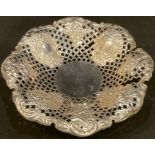 A silver pedestal shaped circular sweetmeat dish, pierced and embossed, Sheffield 1926, 211g, 6.8toz