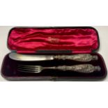 A Victorian silver knife and fork set, the handles in relief with maiden and putto, mid 19th century