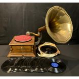 An Edwardian style wind up table top gramophone with brass horn; a selection of shellac records