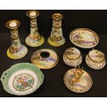 An early 20th century Japanese Noritake seven piece dressing table set, painted with peaceful lake