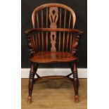 A 19th century Windsor elbow chair, low hoop back, shaped and pierced splat, turned arm posts,