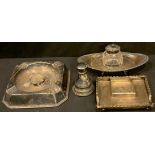 A Victorian silver ink stand, Chester 1899; another (lacking inkwell); a silver ashtray, Sheffield