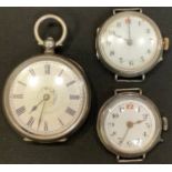 A World War I period silver trench type wristwatch, import mark for London 1918; another, similar; a