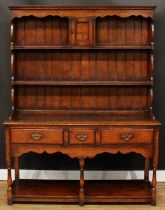 An oak dresser, probably Titchmarsh & Goodwin, 179.5cm high, 137.5cm wide, 43cm deep