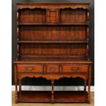 An oak dresser, probably Titchmarsh & Goodwin, 179.5cm high, 137.5cm wide, 43cm deep