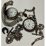 A silver half Hunter pocket watch; another, open face; a silver Albert; fobs, etc