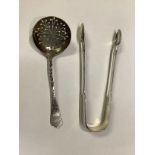 A Victorian silver sugar sifter spoon engraved with flower heads and leaves, Sheffield, 1900; a pair