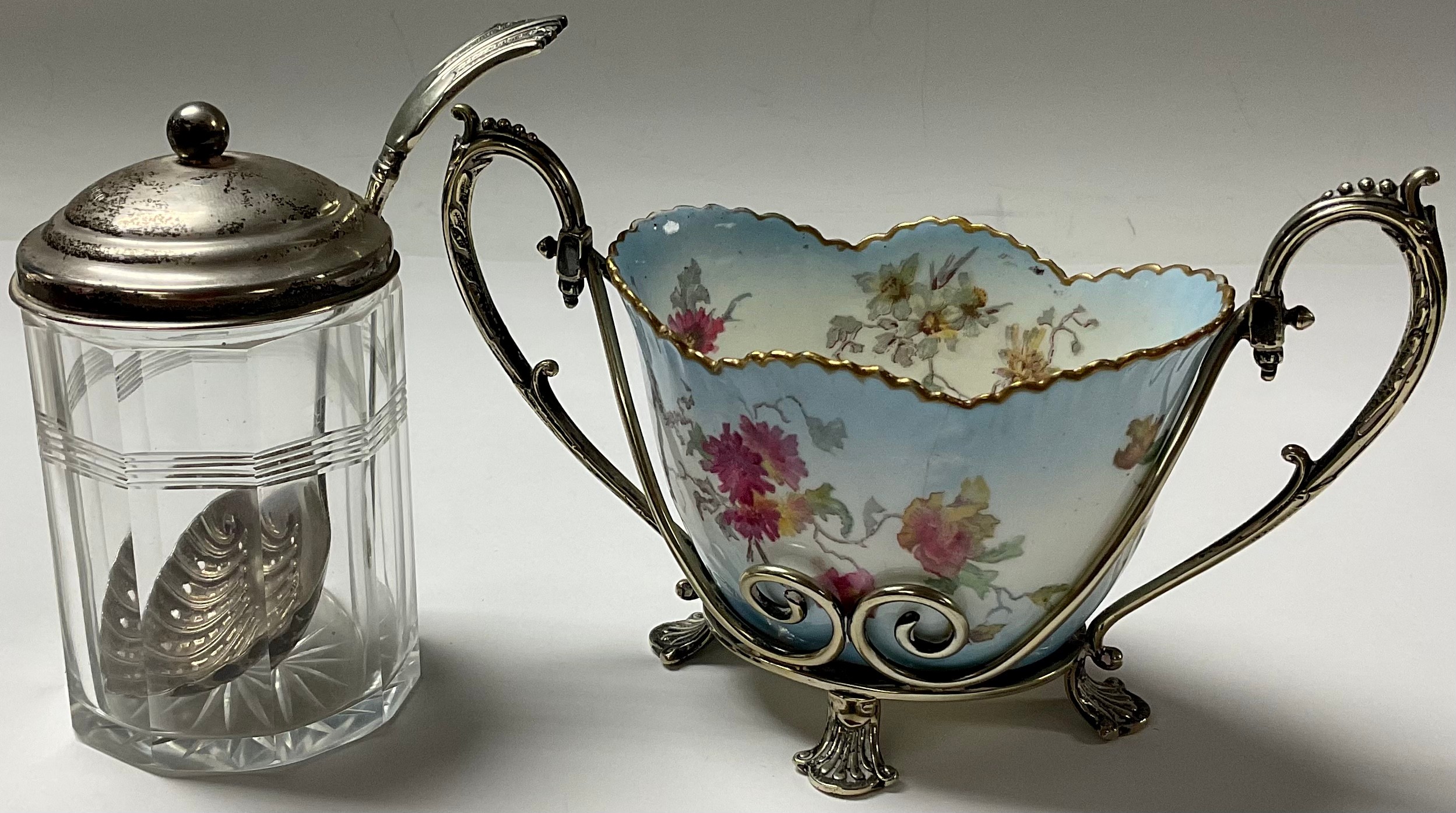 A George V silver mounted cut glass preserve jar, 11cm, Sheffield 1913; an EPNS mounted George Jones