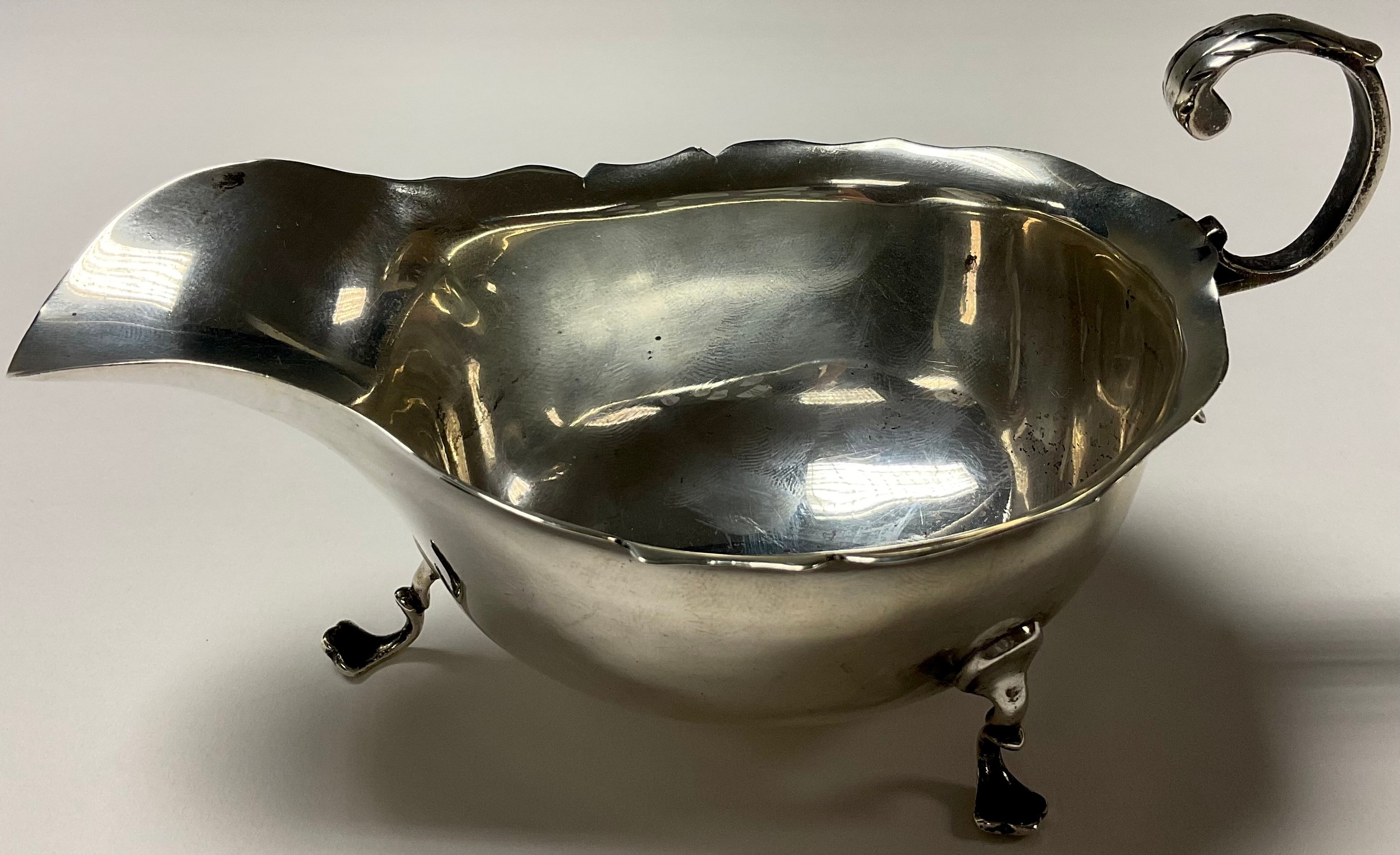 An Edwardian silver sauce boat in George III style, acanthus capped flying s-scroll handle, - Image 2 of 2