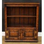An oak bookcase, probably Titchmarsh & Goodwin, 96cm high, 84cm wide, 26cm deep