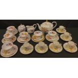 A Caverswall Summer pattern tea set comprising octagonal teapot, sucrier and cover, milk jug, five