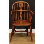 A 19th century Windsor elbow chair, low hoop back, shaped and pierced splat, turned arm posts,