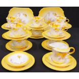 A Shelley Phlox pattern part tea service comprising cake plate, side plates, cream jug, cups and