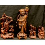 A Chinese carved hardwood table lamp, as Shou Loa, 40cm high; others, figure with sheep; bearded