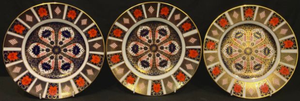 A Royal Crown Derby Imari palette 1128 pattern dinner plate, 27cm, first quality; two others,